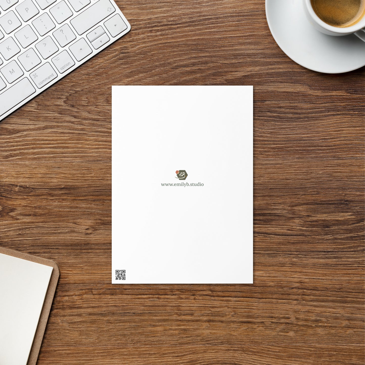 Back view of illustrated greetings card showing brand logo and website