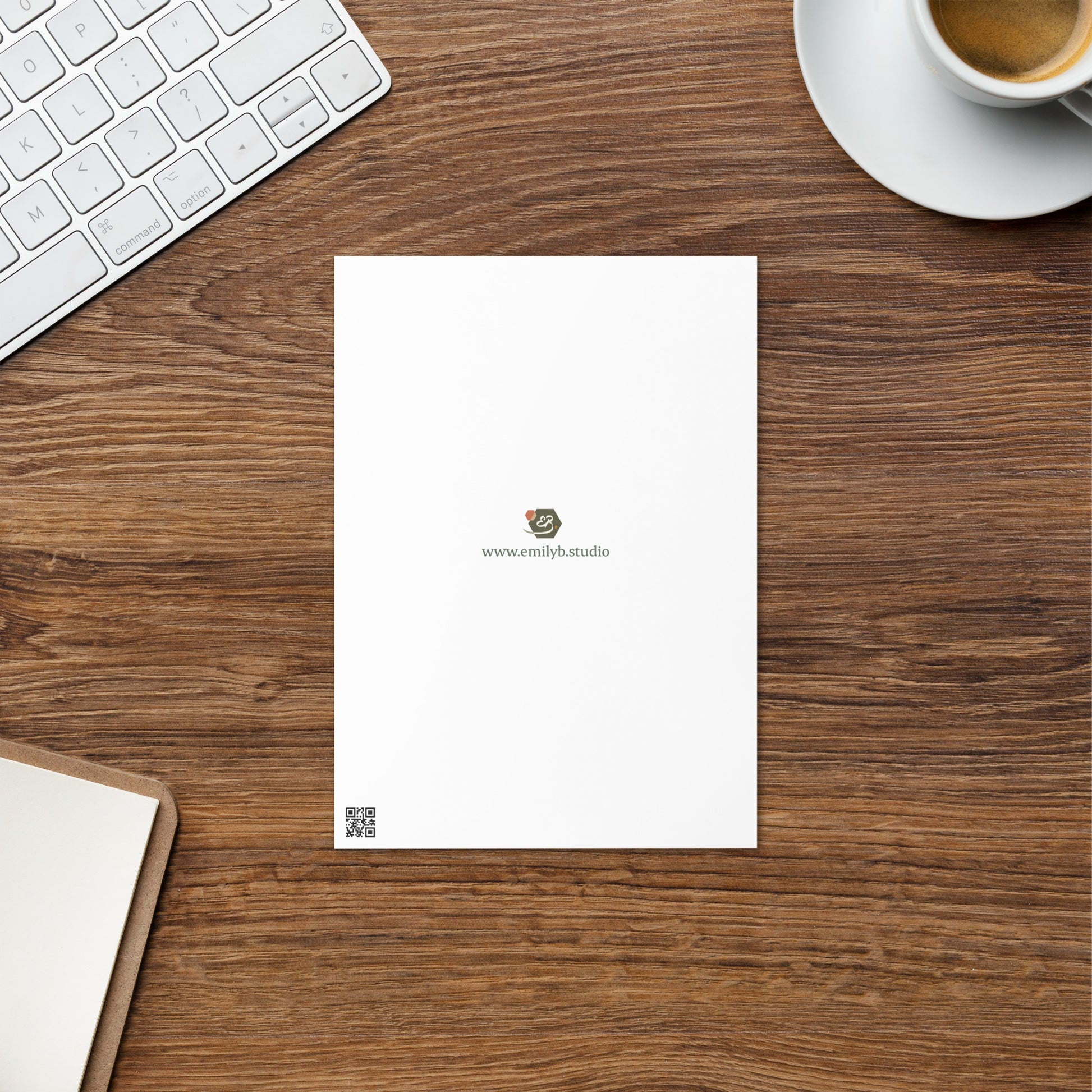 Back view of illustrated greetings card showing brand logo and website