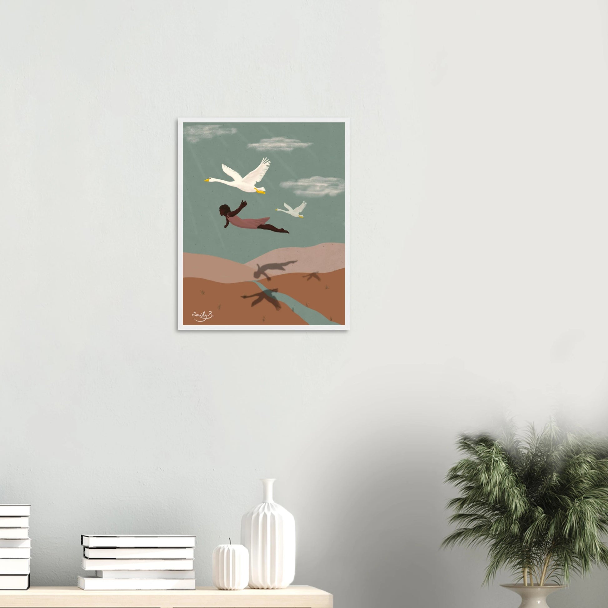 Framed Flying With Swans illustrated art print displayed in a creative room